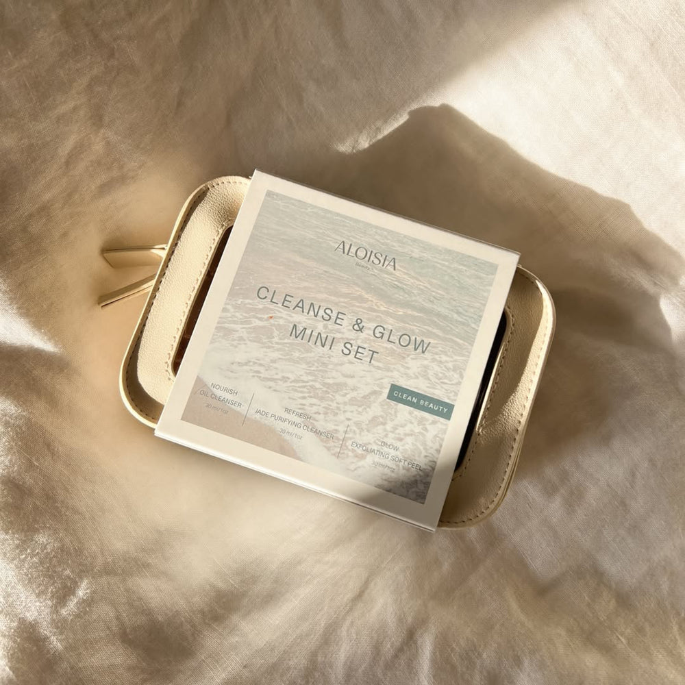 Cleanse & Glow Discovery Set includes NOURISH Oil Cleanser, REFRESH Jade Purifying Cleanser and Headband in a travel case