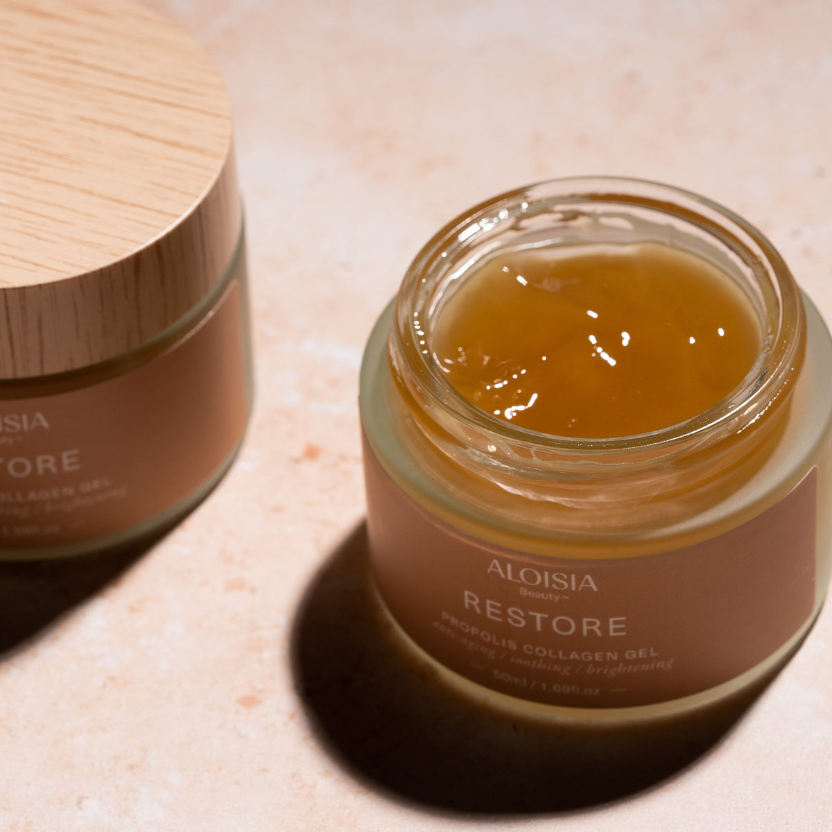 Aloisia Restore Propolis Collagen Gel jar on a light surface