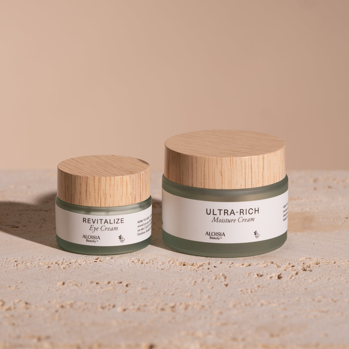 REVITALIZE Eye Cream and ULTRA-RICH Moisture Cream jars side by side